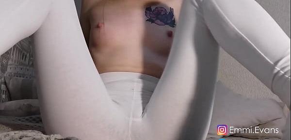  In white leggings and socks, she shows her legs and tits